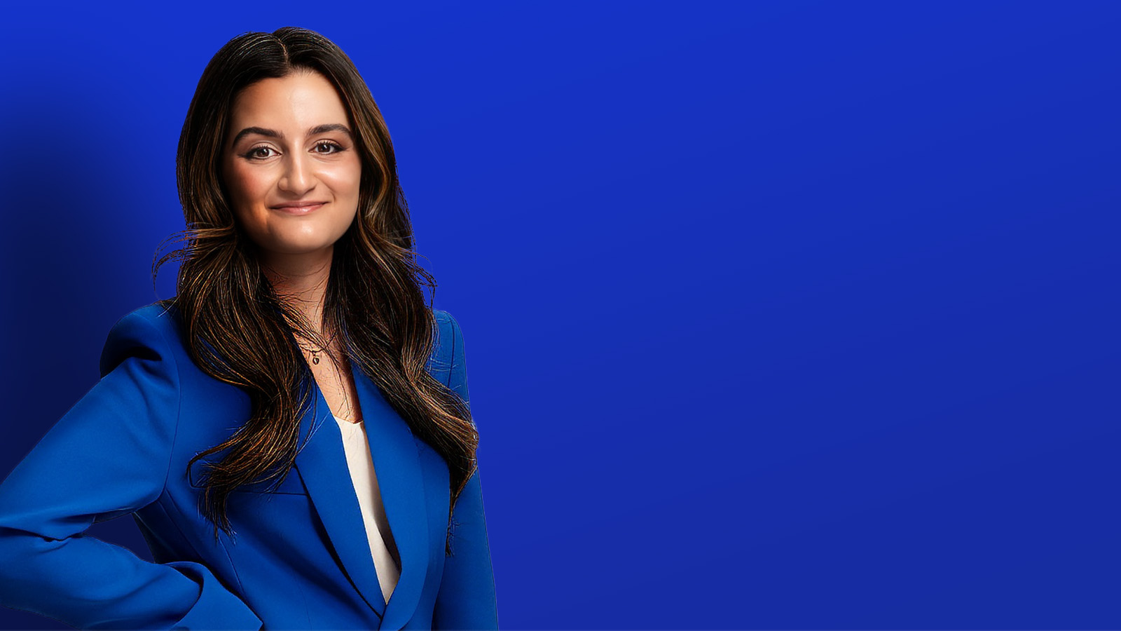 Persheng smiling in front of blue background